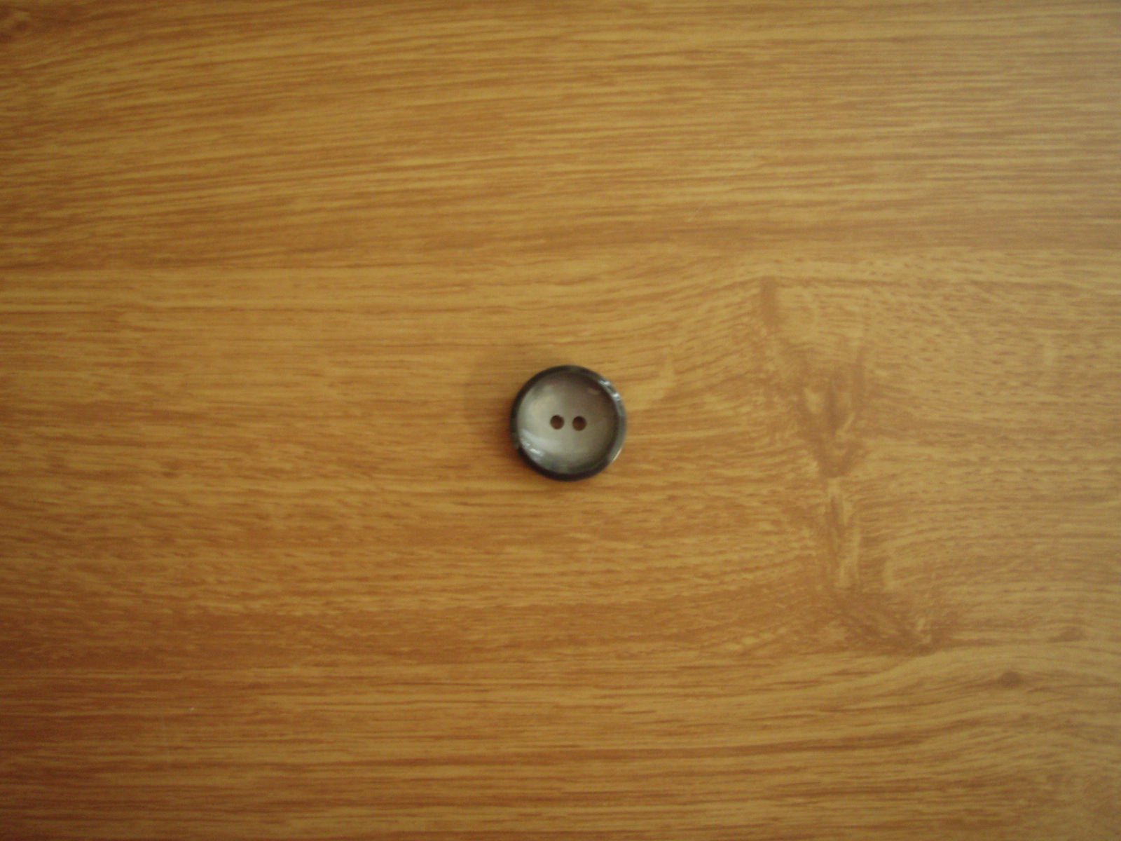 Knapp 4-håls 23mm fg. Grå