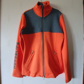 Jacka  i härlig orange med grå detaljer. Supper bra att rida i så man syns .Reflex tryck som tillval  - 8