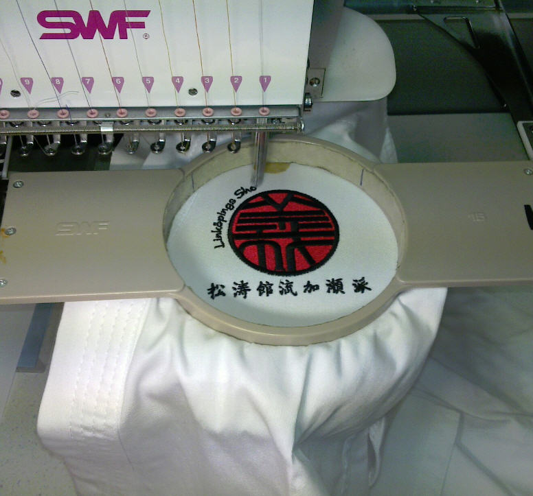 Embroidery of logo on suit