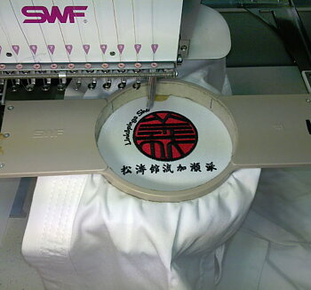 Embroidery of logo on suit