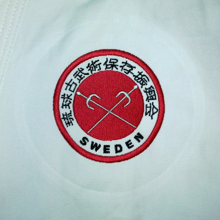 Embroidery of logo on suit - 3