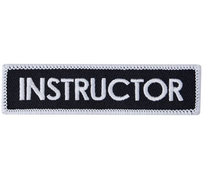 Broderat Märke, Instructor