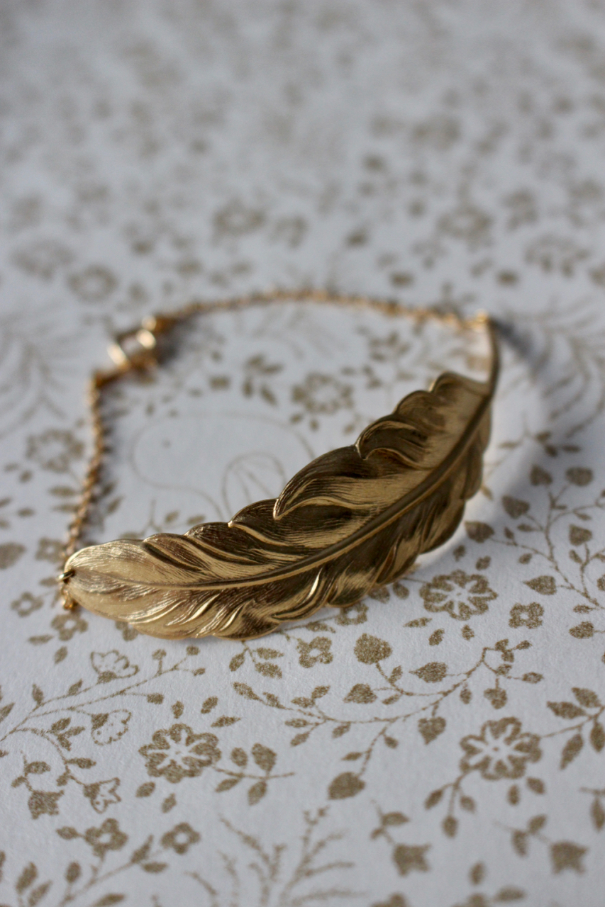 Armband, fjäder