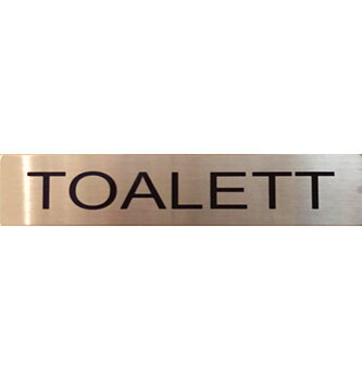 Skylt "TOALETT"