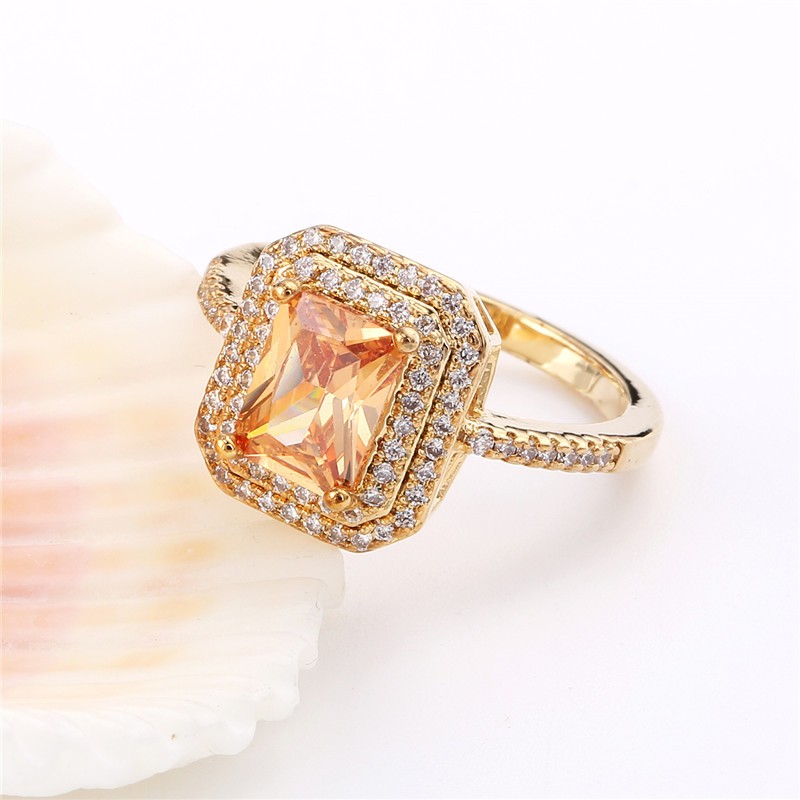 Ring "Princess Cut" med många små  vita och en stor orange Cubic Zirconia samt i 18K Guldplätering - 5