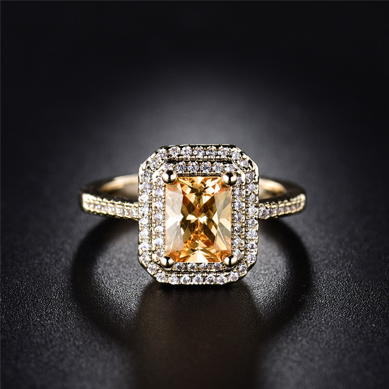 Ring "Princess Cut" med många små  vita och en stor orange Cubic Zirconia samt i 18K Guldplätering - 2