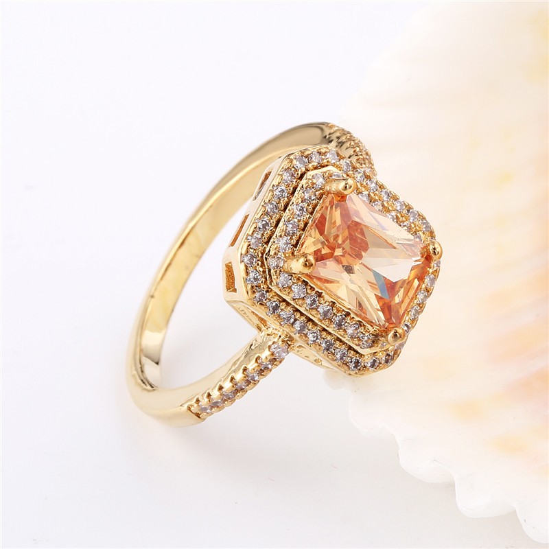 Ring "Princess Cut" med många små  vita och en stor orange Cubic Zirconia samt i 18K Guldplätering - 6