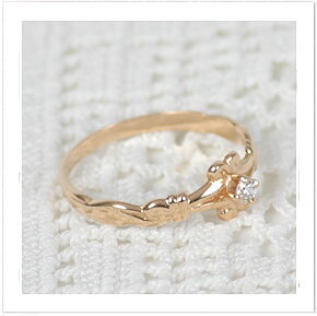 Guldring 18 karat med vit zirkonia