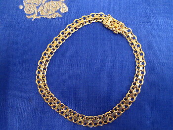 Armband i 18 K guld . Design X-länk.