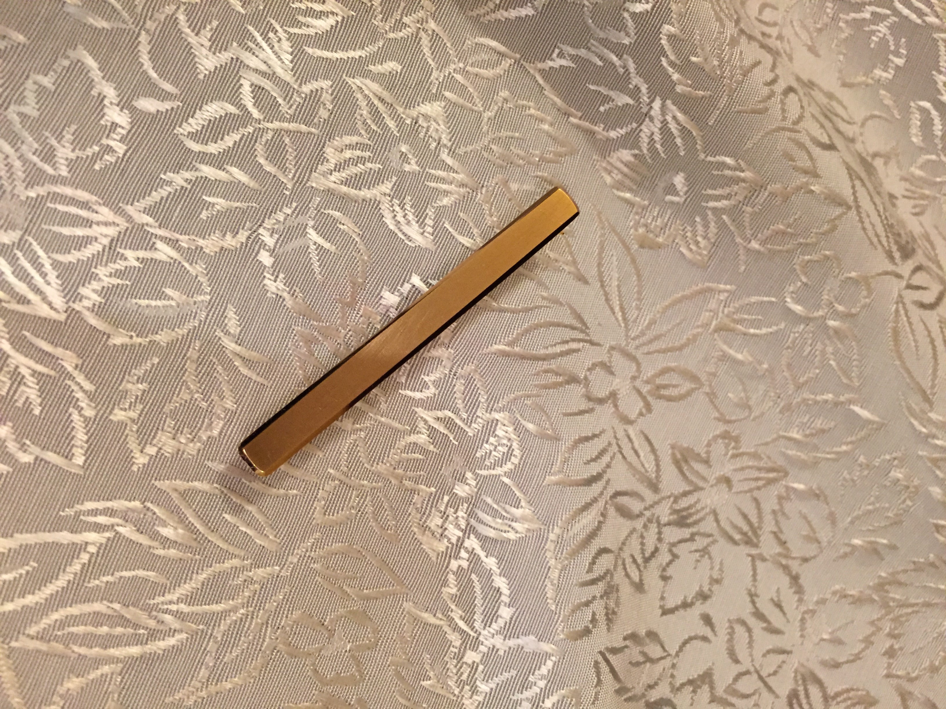 Slipshållare i 18 Karats guld.Fasettslipade kanter. 1965
