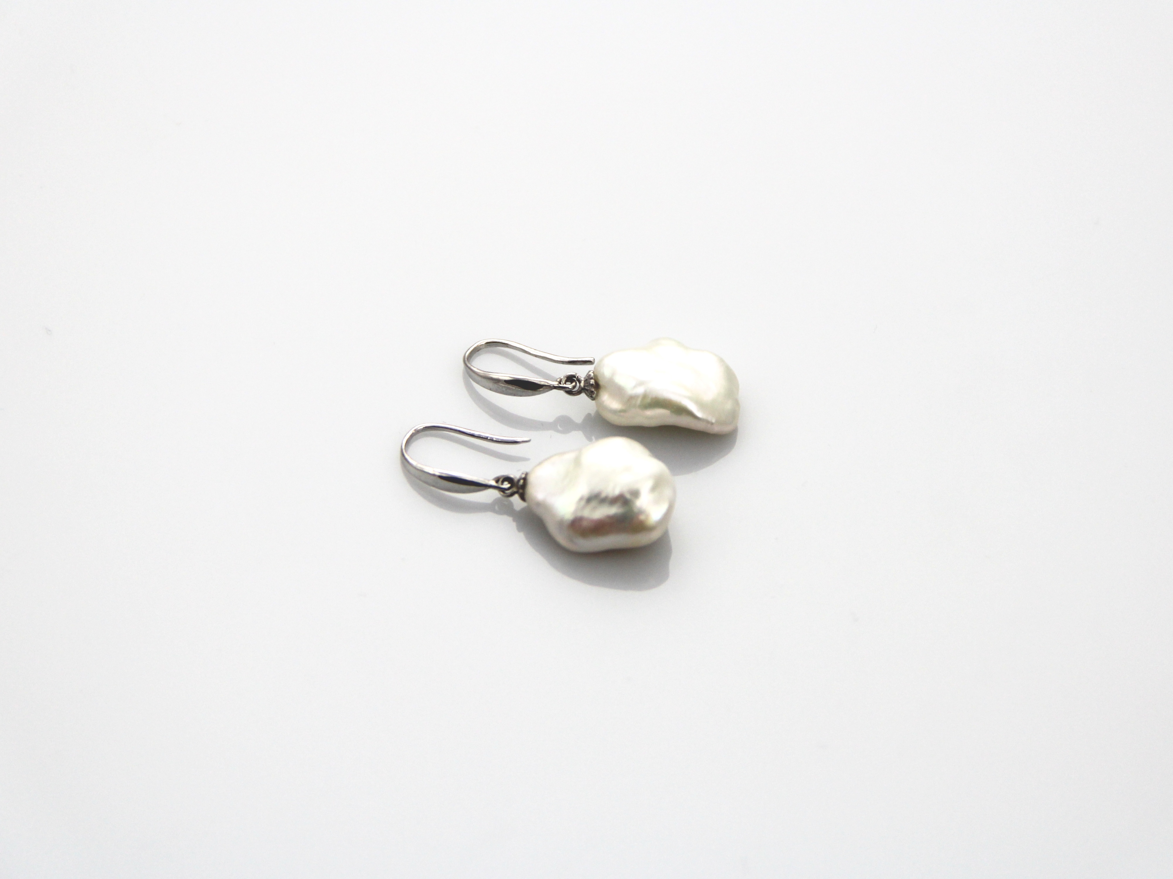 Fresh water Baroque shape pearl earrings set in Silver