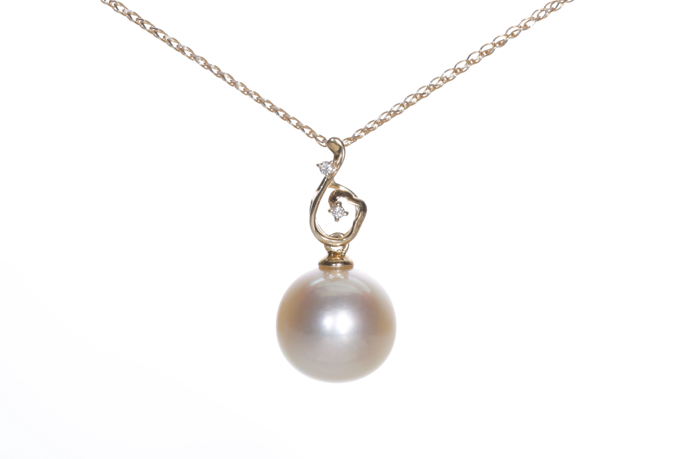 South sea cultured Champagne color pearl set in gold and diamonds
