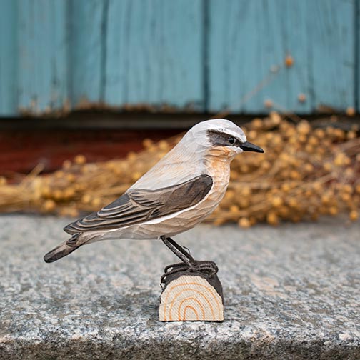 DecoBird Northern Wheatear, hand carved wooden bird painted with environmentally friendly colours, outdoors