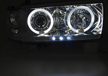 STRÅLKASTARE TOYOTA LAND CRUISER FJ 80 90-97 KROMADE