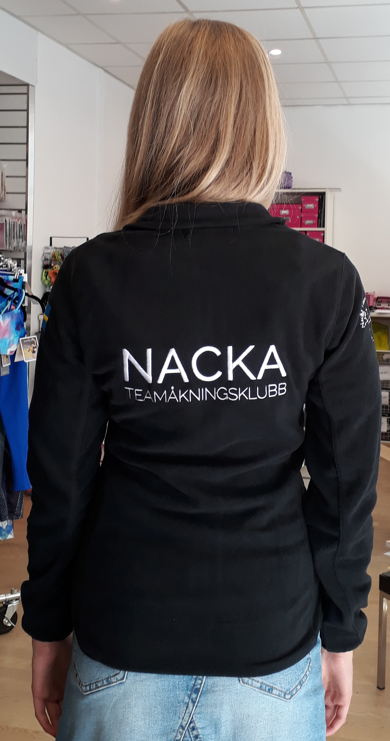 Svart fleecejacka  Nacka teamåkningsklubb 