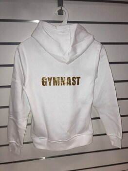 Texten "Gymnast" i glittertryck i olika färger