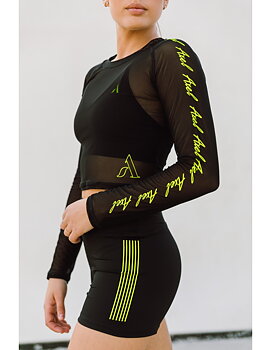 Genomskinlig crop top från Axelartistics med gula detaljer