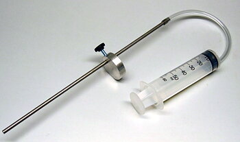 Oil level adjuster