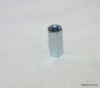 Hexagonal nut M6, threaded at one end, hexagonal in others. Length 23.5 mm