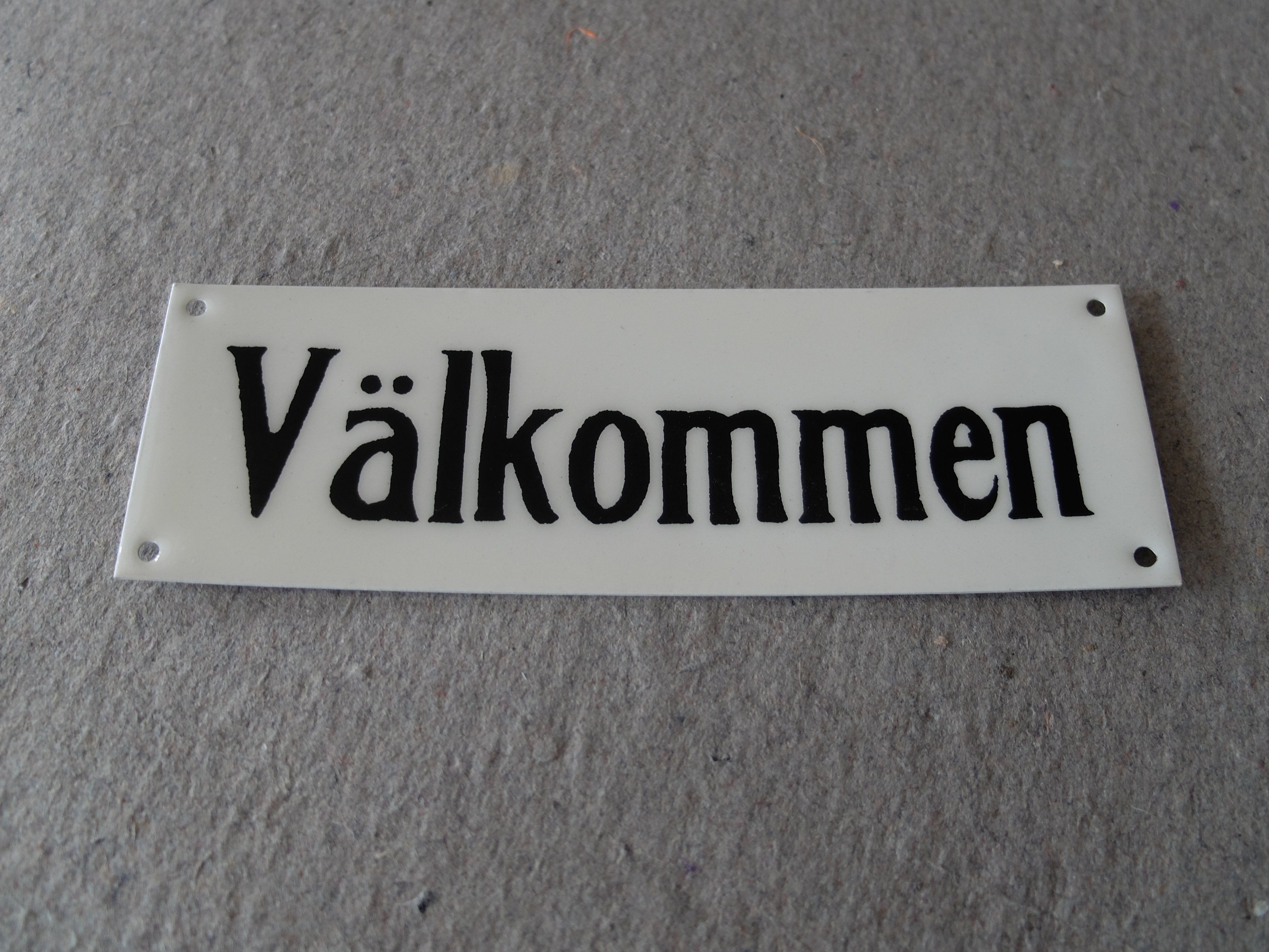 Välkommen/skylt