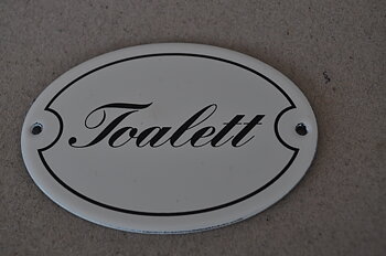 DÖRRSKYLT/Toalett