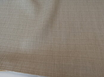 Mellan beige lite gövre tyg 