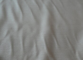 beige helt omönstrat tyg med Aloe