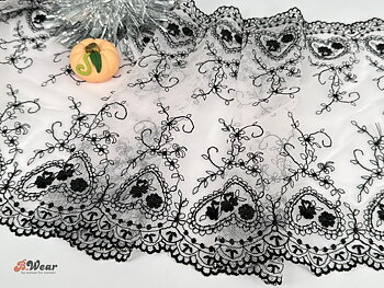 Non stretch lace in pale pink with black embroidered hearts - 25 cm