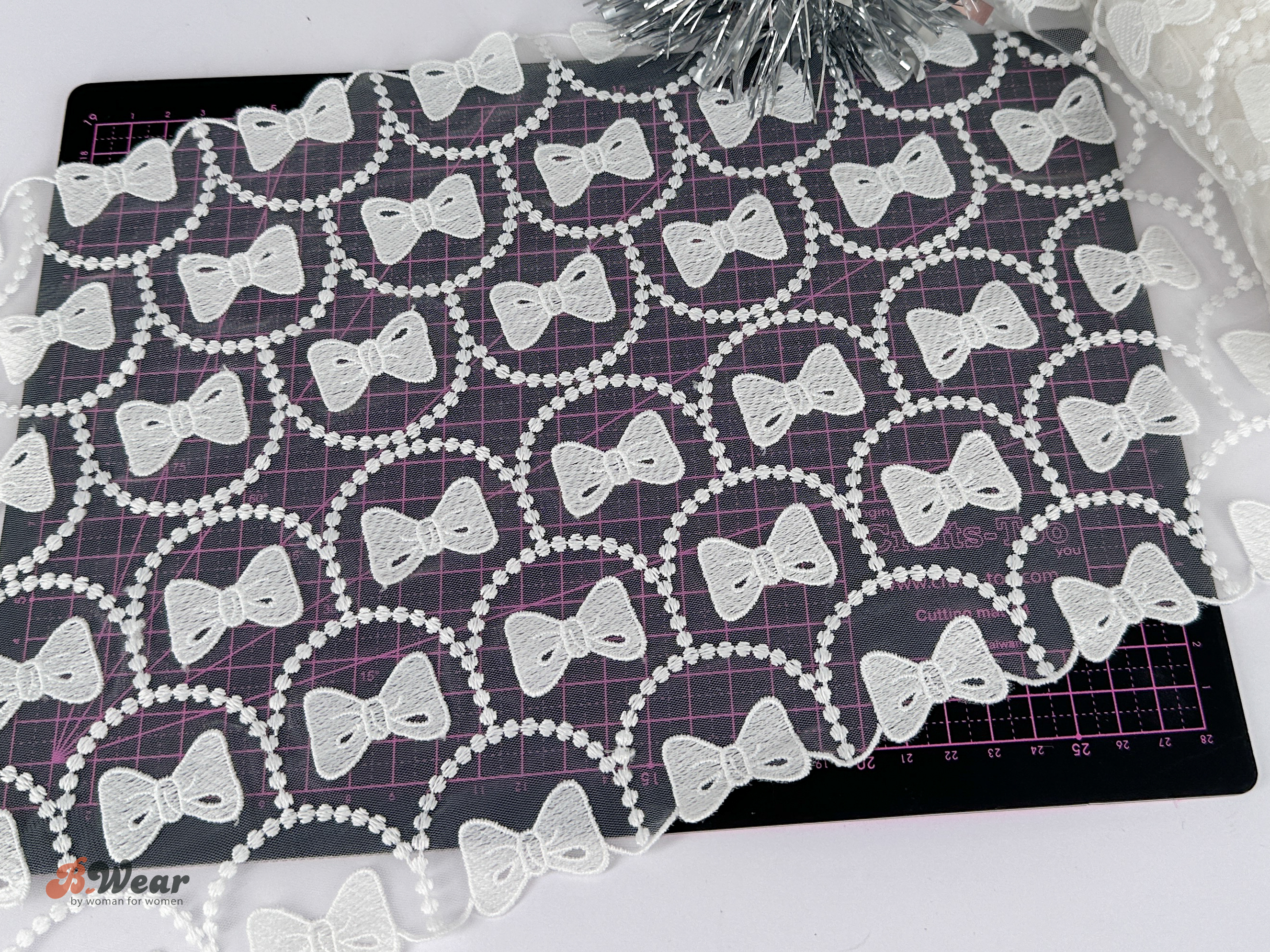 Mesh lace in white with bows