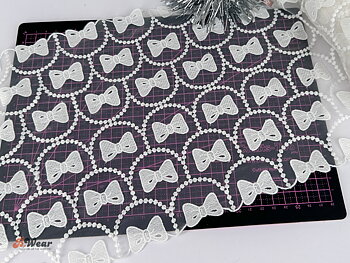 Mesh lace in white with bows