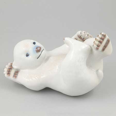 Merete Agergaard Bing & Gröndahl and Royal Copenhagen Polar bear cub on back, model 537. Manufactured by Bing & Grøndahl as model 2537 before the 1987 merger with Royal Copenhagen