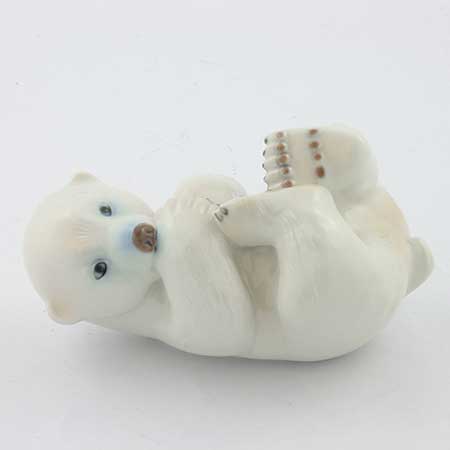 Merete Agergaard Bing & Gröndahl and Royal Copenhagen Polar bear cub on back, model 538. Manufactured by Bing & Grøndahl as model 2538 before the 1987 merger with Royal Copenhagen