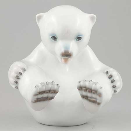 Merete Agergaard Bing & Gröndahl and Royal Copenhagen Polar bear cub with feet up, model 536. Manufactured by Bing & Grøndahl as model 2536 before the 1987 merger with Royal Copenhagen
