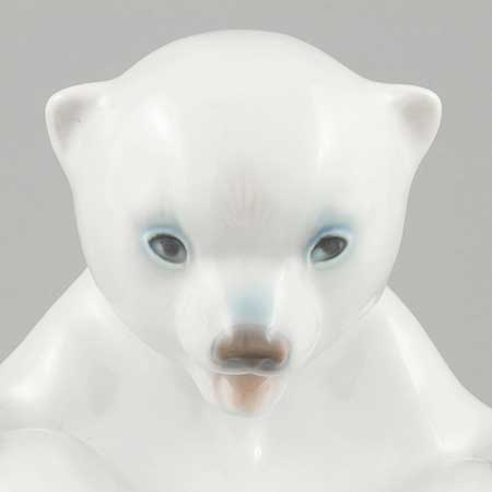 Merete Agergaard Bing & Gröndahl and Royal Copenhagen Polar bear cub with feet up, model 536. Manufactured by Bing & Grøndahl as model 2536 before the 1987 merger with Royal Copenhagen