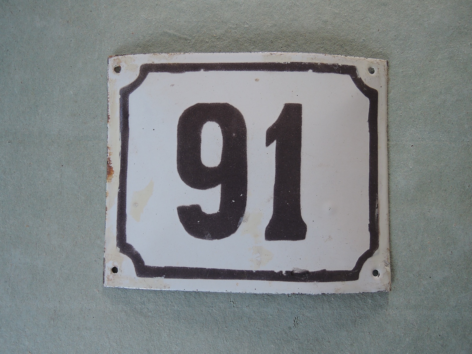 Gammal emaljskylt nummer 91