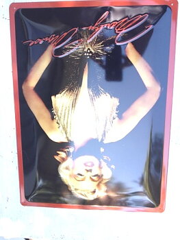 Tin sign.   Marlyn Monroe