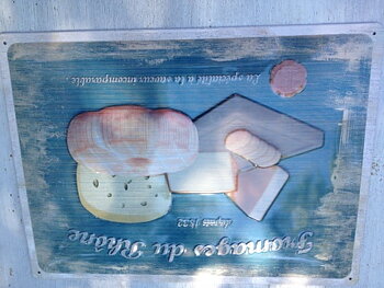 Tin sign.    Cheese