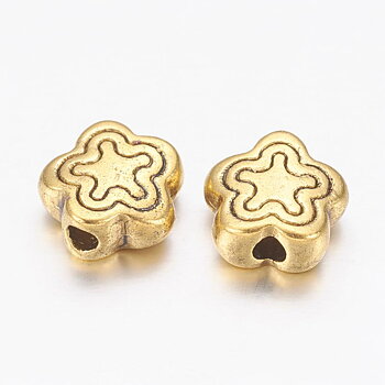 Spacer bead flower gold, 7mm