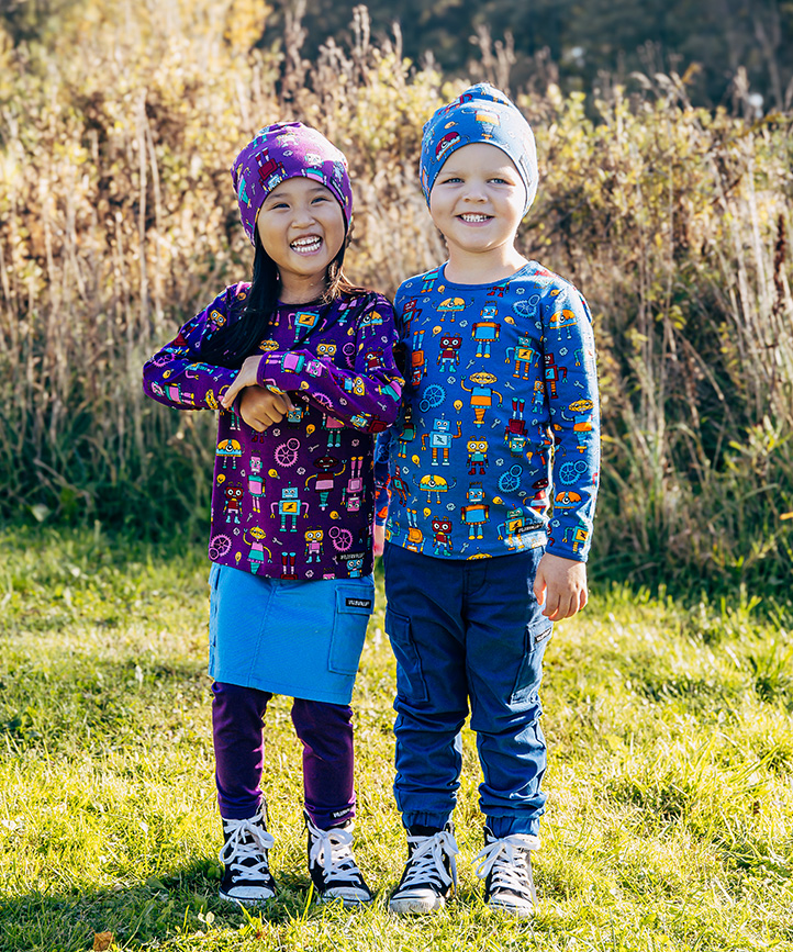 Three kids wearing colourful fleece