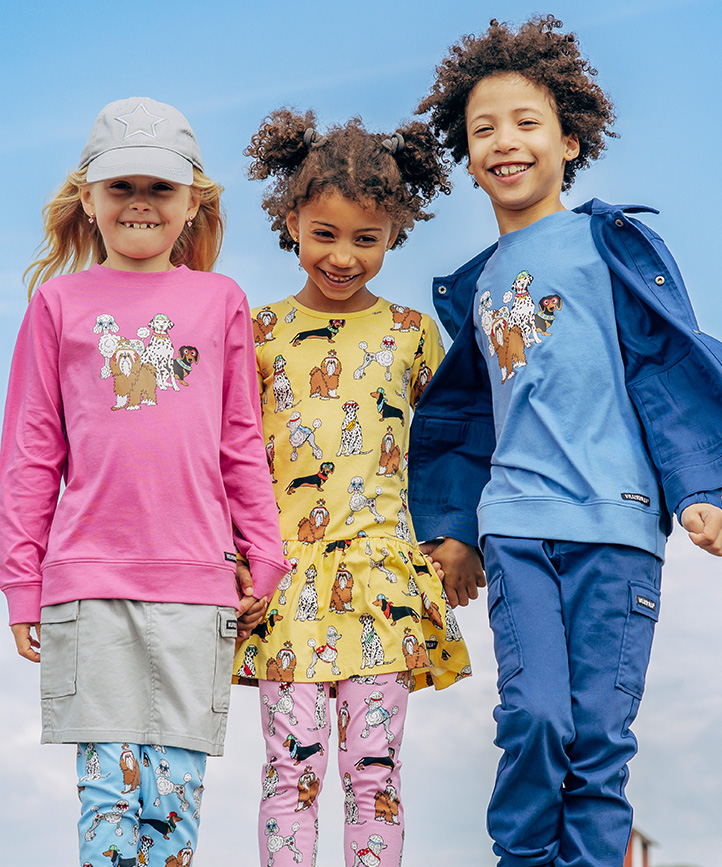 Three kids wearing colourful fleece