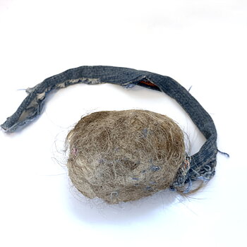 Sheep fur dog toy with a handle