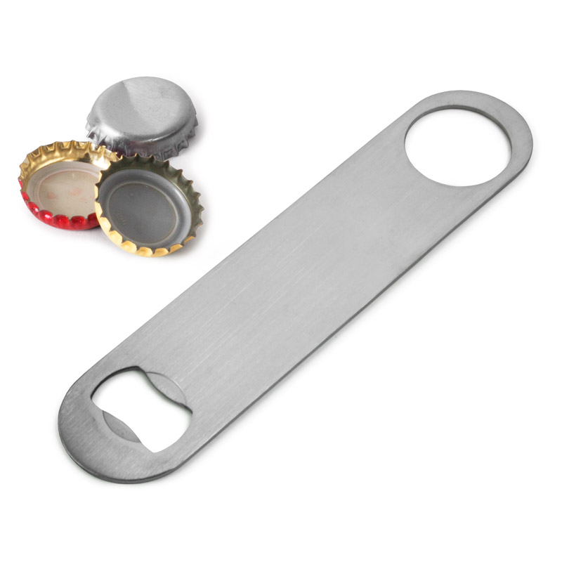 Barblade i rostfritt stål bredvid kapsyler