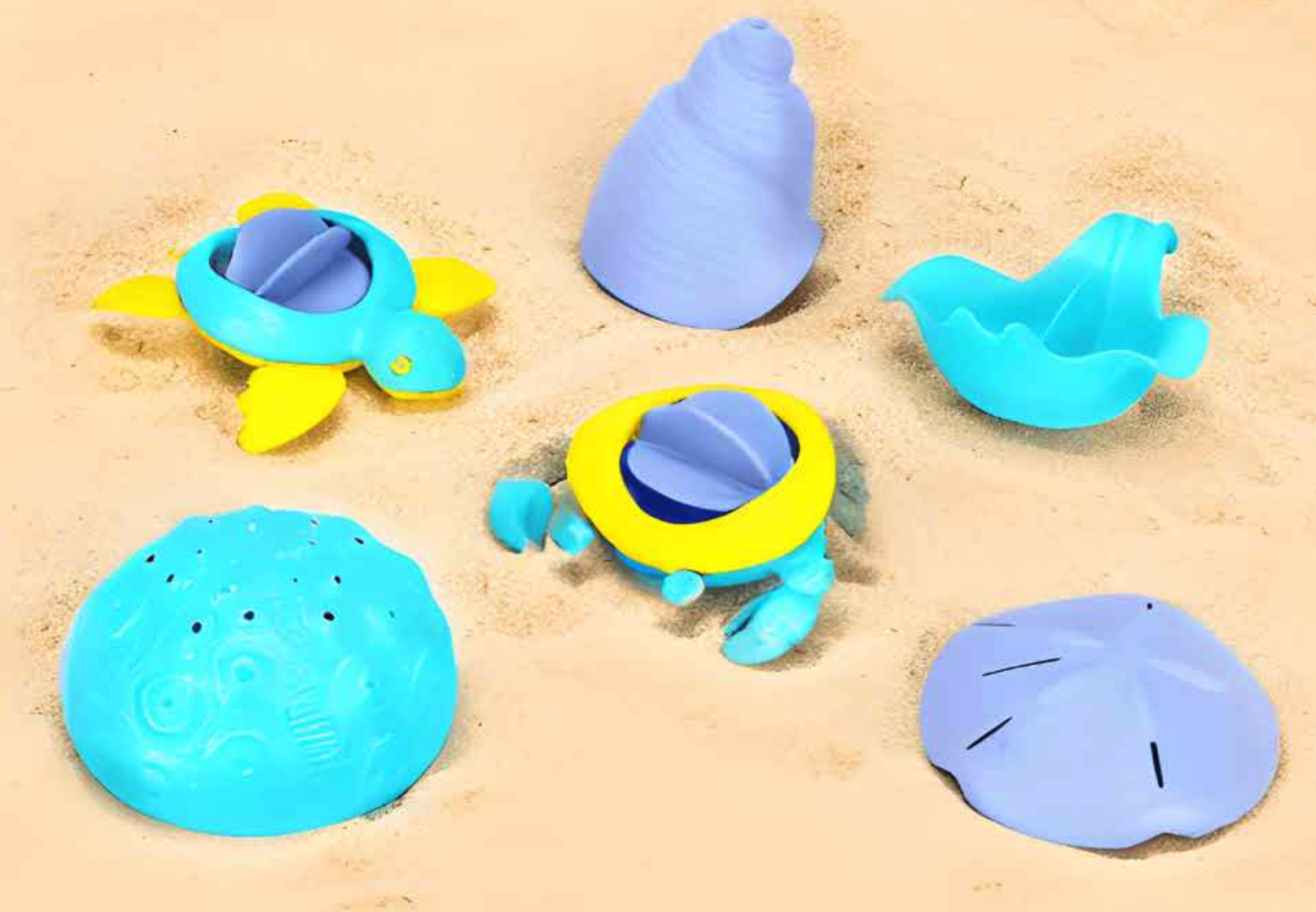 Greentoys blå och lila strandleksaker i sanden
