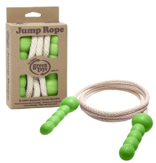 Barnhopprep i kartong och hopprep bredvid med gröna handtag