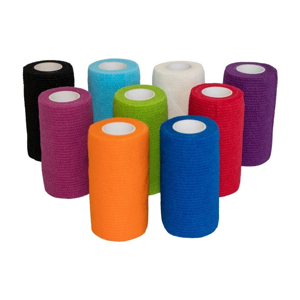 Gekleurde rollen Vetrap zelfklevend elastisch verband rechtop naast elkaar.