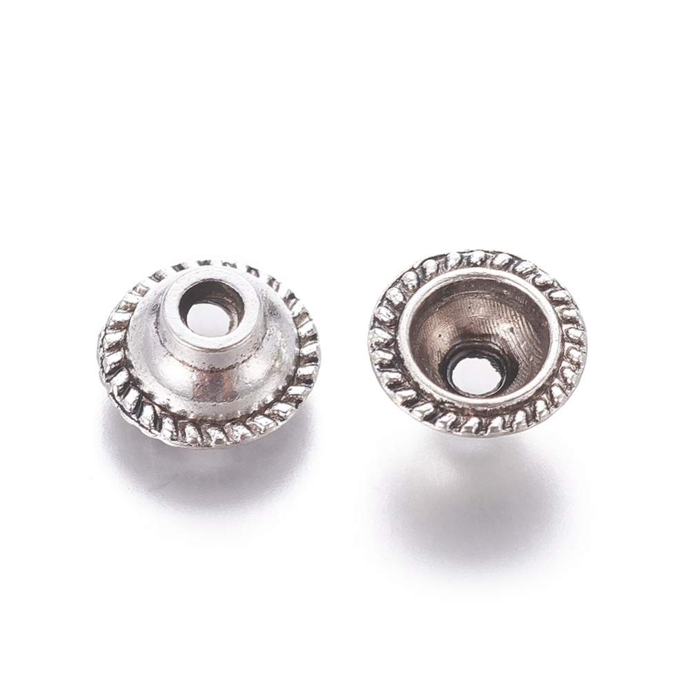 Antiksilverfärgade pärlkåpor i balimodell ca 10 mm med mönstrad yta, 20 st.