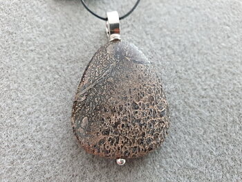 Dinosaur bone flat irregular 37-39x27-32x6-9cm, pendant with strong round loop approx. 10,7x3,6mm, 925-silver