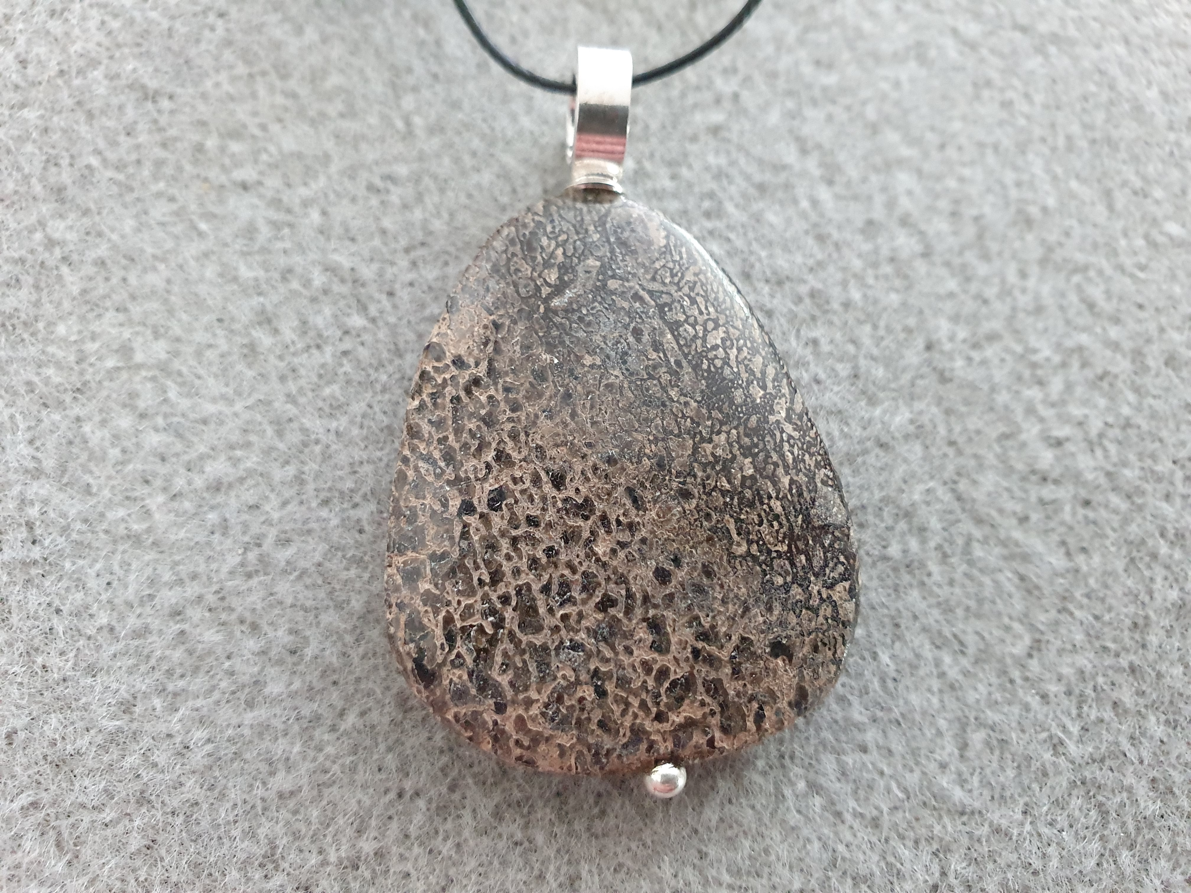 Dinosaur bone flat irregular 37-39x27-32x6-9cm, pendant with strong round loop approx. 10,7x3,6mm, 925-silver - 2