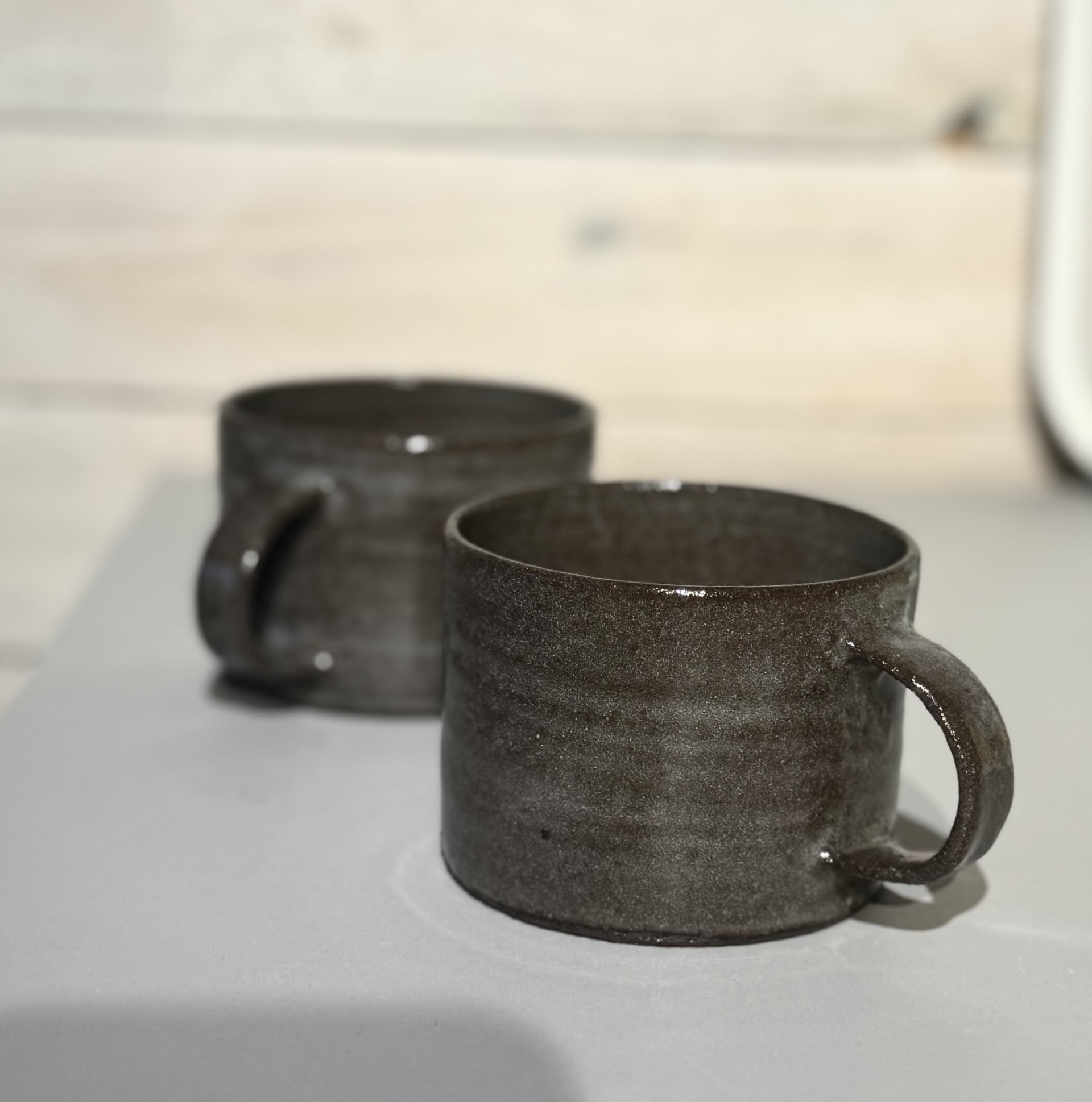 WAVE teacup in a brown clay