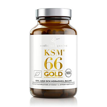en brun burk i glas med en vit etikett. På etiketten guldtext som säger KSM66 gold